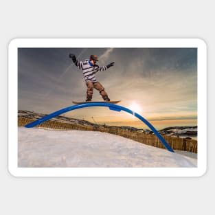 Snowboarder sliding on a rail Sticker